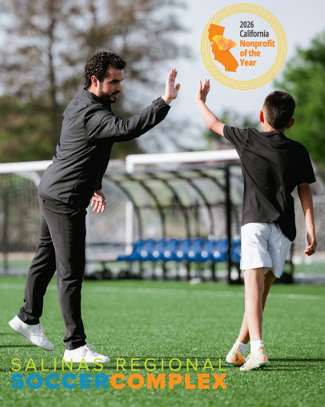 Soccer players giving high fives to each other.