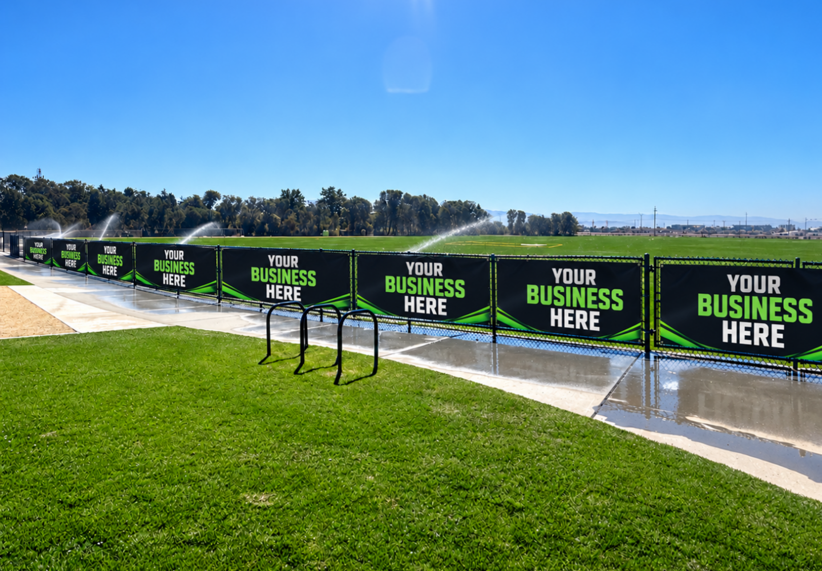 Advertising banners attached to soccer field fences at the Salinas Regional Soccer Complex.